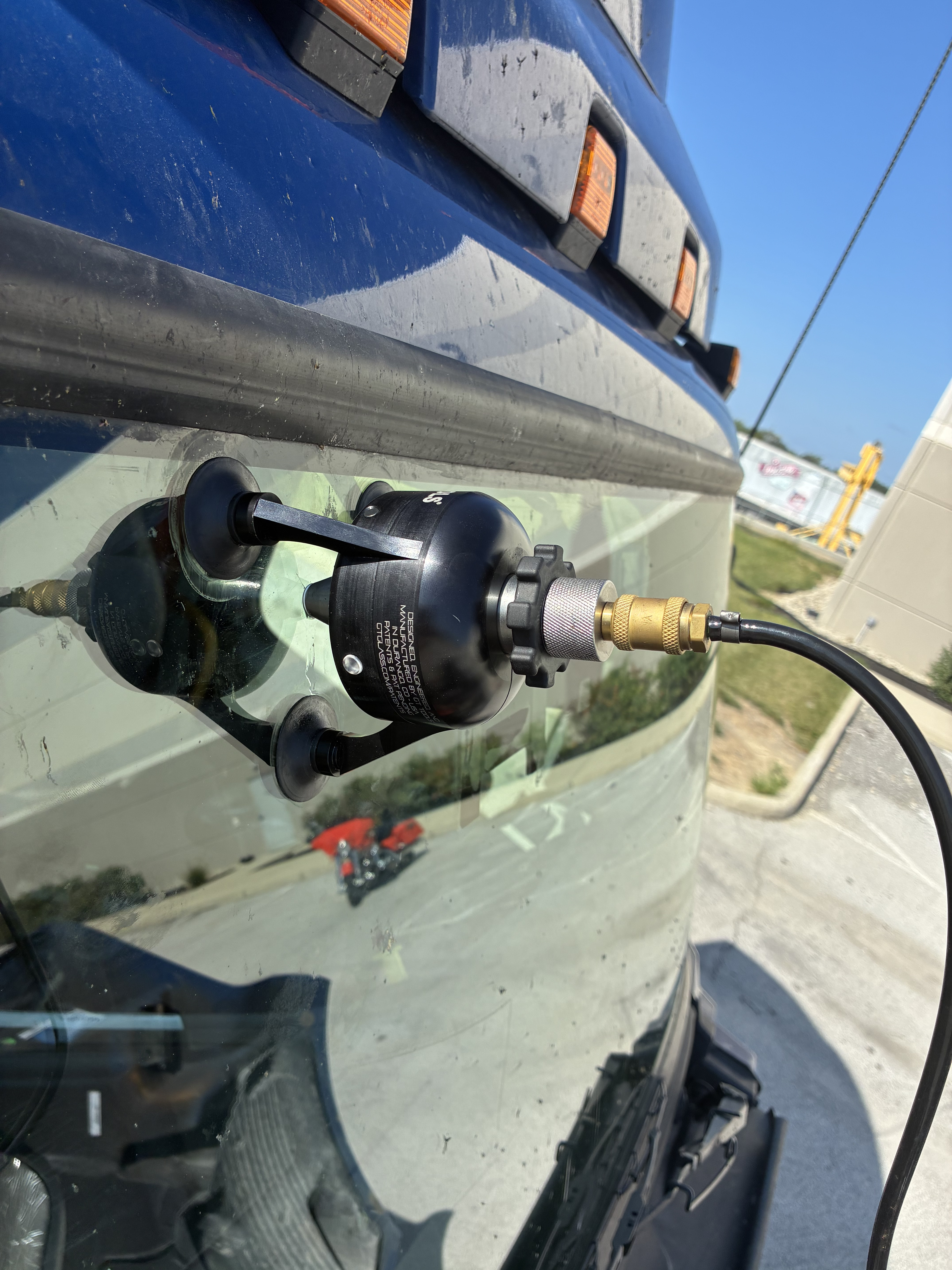 Windshield repair equipment attached to vehicle glass
