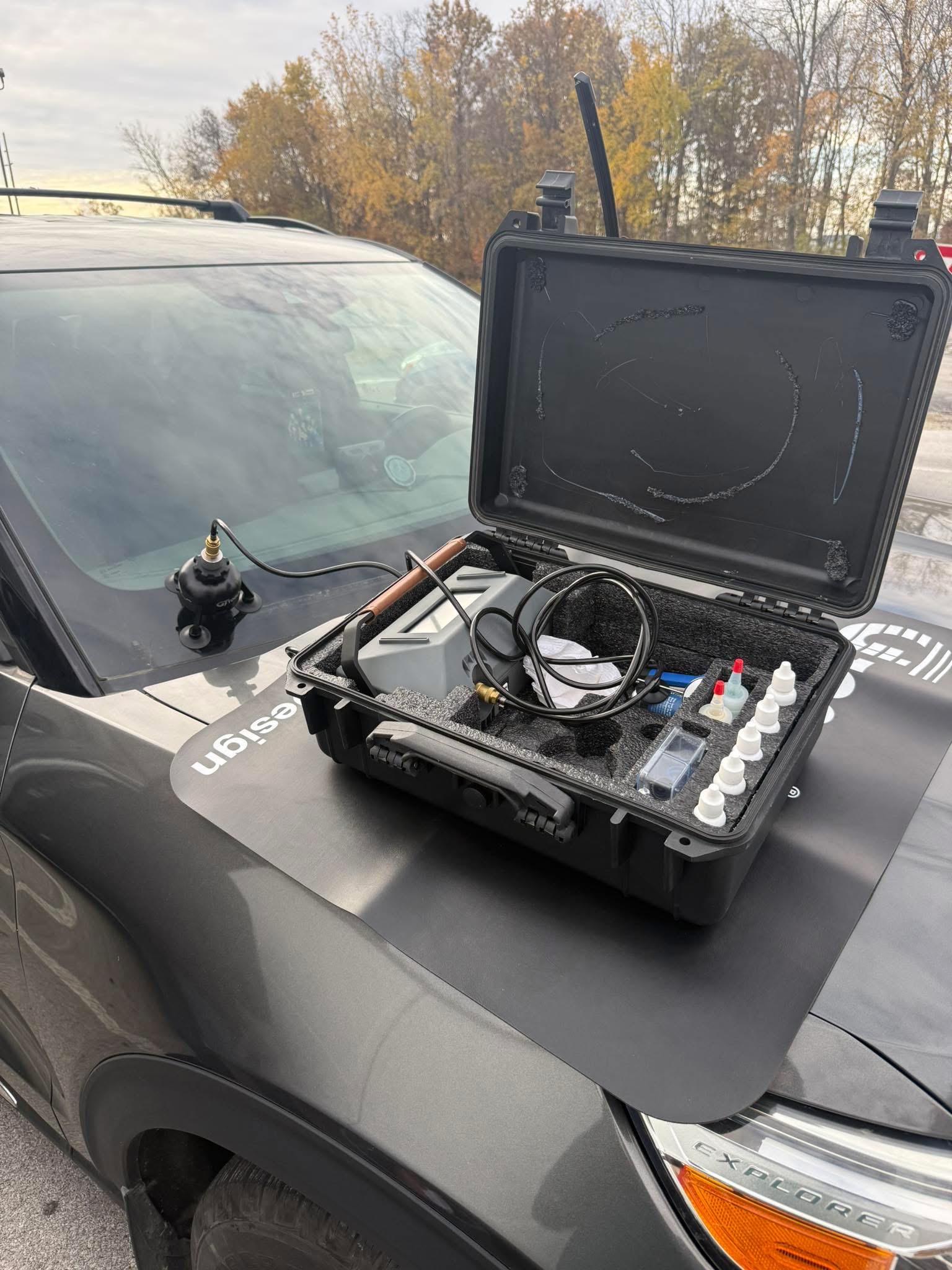 Auto glass tools set up on a vehicle for mobile service